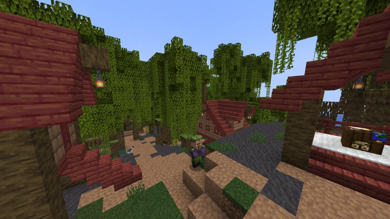 A few houses and a villager from a mangrove swamp village