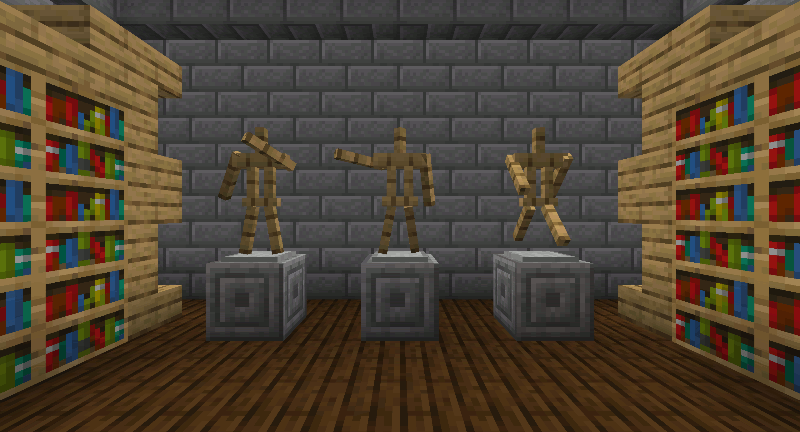 Three armor stands with arms in different poses