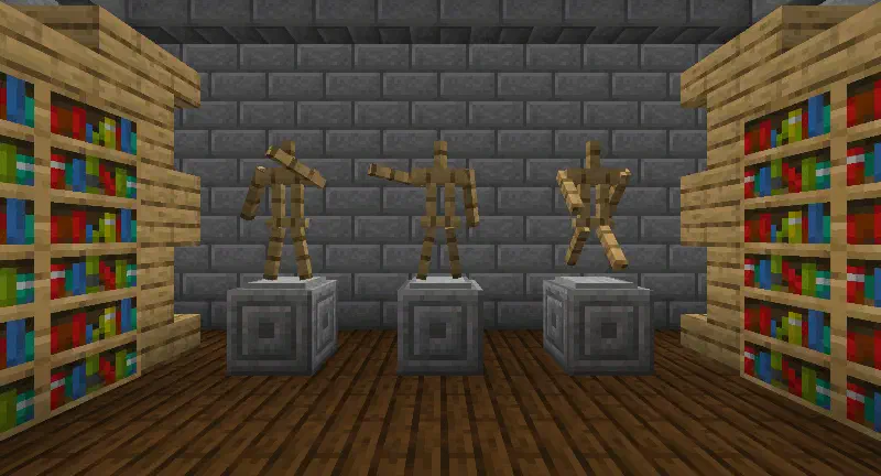 Three armor stands with arms in different poses